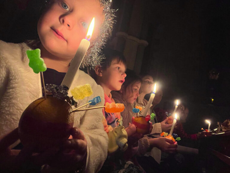 Children holding candles